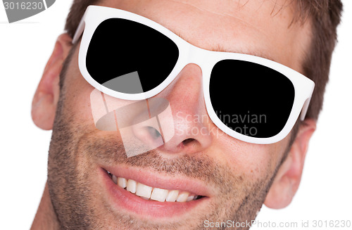 Image of Close-up of a man wearing white sunglasses 