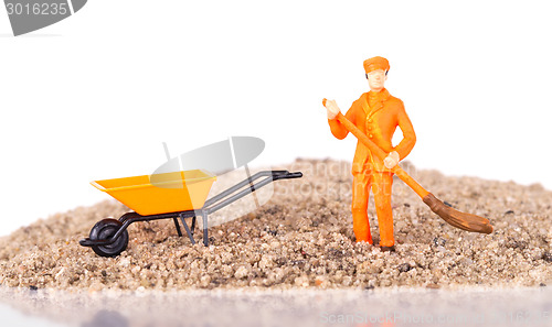 Image of Miniature worker is cleaning a keyboard