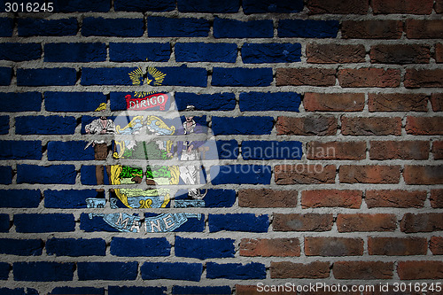 Image of Brick wall texture with flag