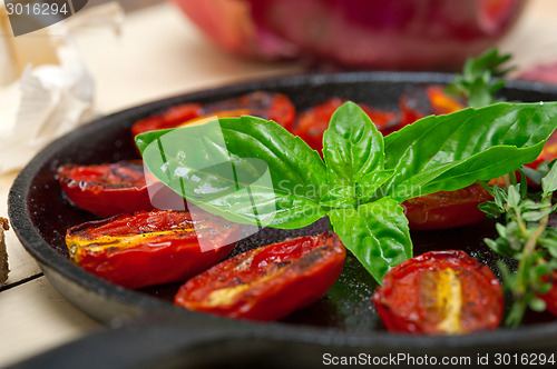 Image of baked cherry tomatoes with basil and thyme