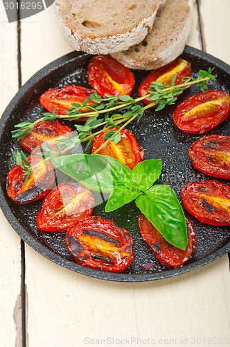 Image of baked cherry tomatoes with basil and thyme