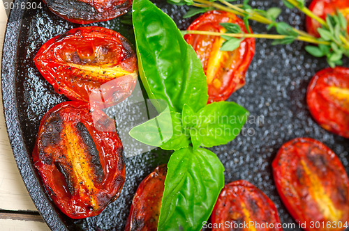 Image of baked cherry tomatoes with basil and thyme