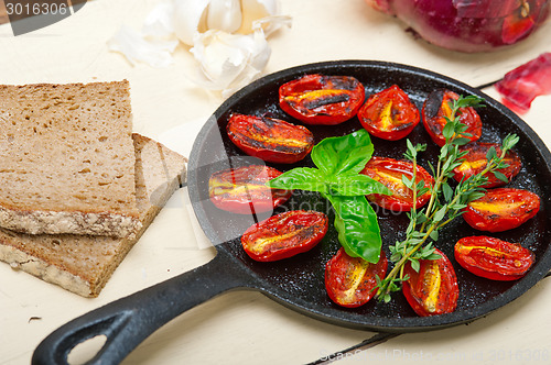 Image of baked cherry tomatoes with basil and thyme