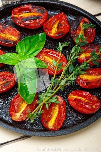 Image of baked cherry tomatoes with basil and thyme