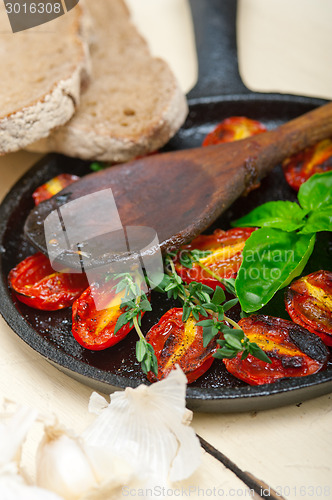 Image of baked cherry tomatoes with basil and thyme