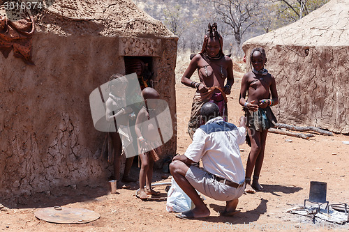 Image of Himba woman with childs in the village