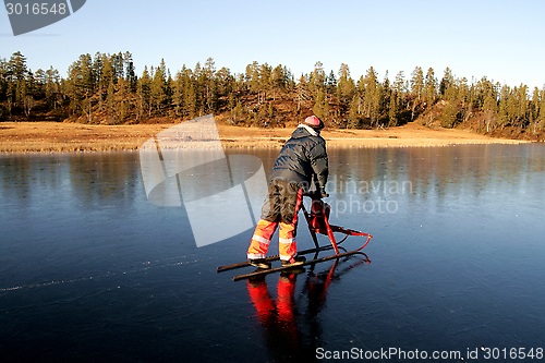 Image of Man on kick sled