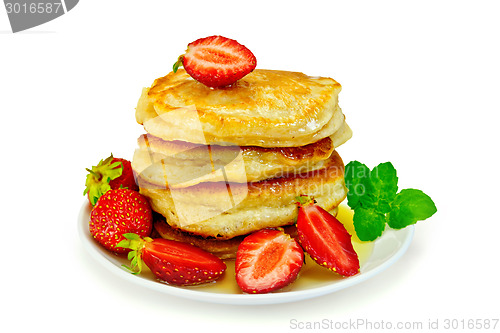 Image of Flapjacks with strawberries and mint in plate