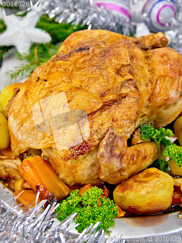 Image of Chicken with silver Christmas tinsel