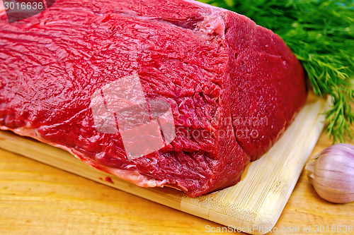Image of Meat beef whole piece on wooden board