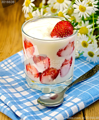 Image of Yogurt thick with strawberries and daisies on board