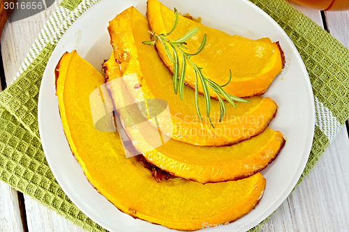 Image of Pumpkin baked with honey in plate on light board