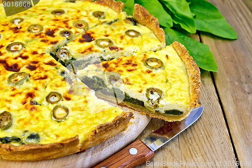 Image of Pie with spinach and cheese on board