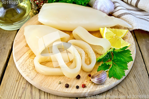 Image of Calamari with lemon and garlic on board