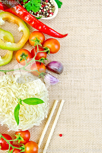 Image of Noodles rice with vegetables stranded on sacking