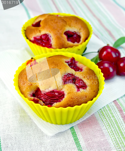 Image of Cupcakes with cherries on napkin