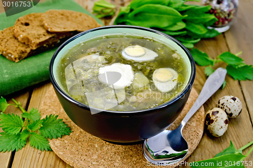 Image of Soup green of sorrel and nettle with quail eggs