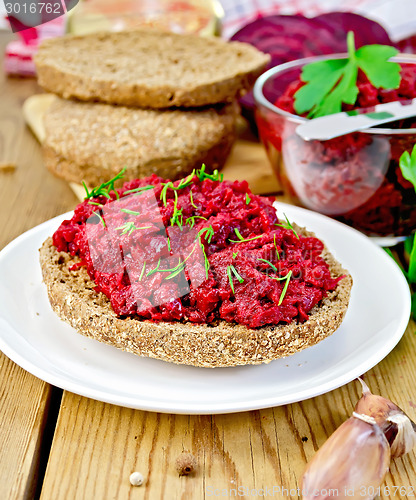 Image of Sandwich with beet caviar on board