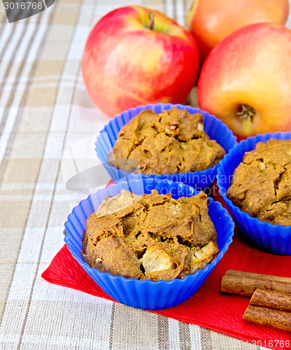 Image of Cupcake rye with apple in tins on fabric