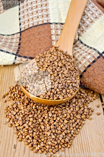 Image of Buckwheat in spoon on board with napkin