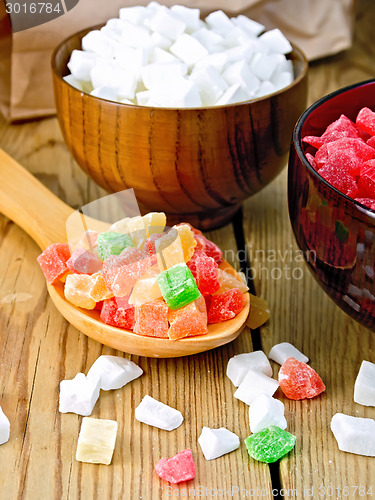 Image of Candied fruit colored in spoon on board