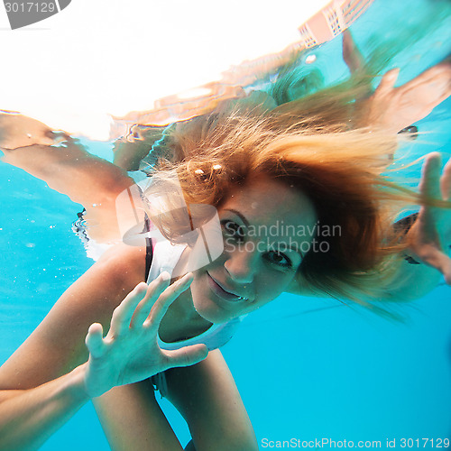 Image of Female with eyes open underwater