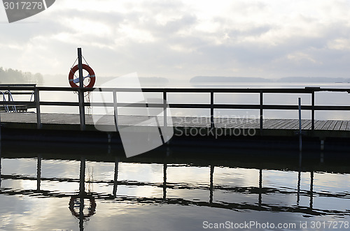 Image of lake and wooden jetty in fog