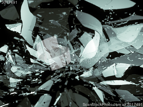 Image of glass breaking pieces on black shallow DOF