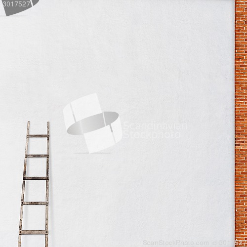 Image of weathered brick wall with a wooden ladder