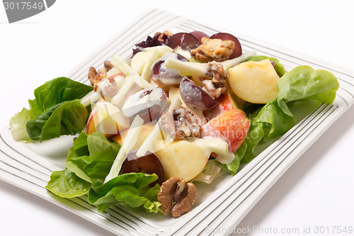 Image of Waldorf salad over white at an angle