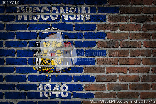 Image of Brick wall texture with flag