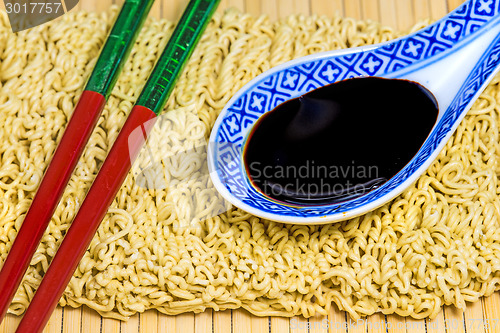 Image of raw chinese noodles with soy sauce