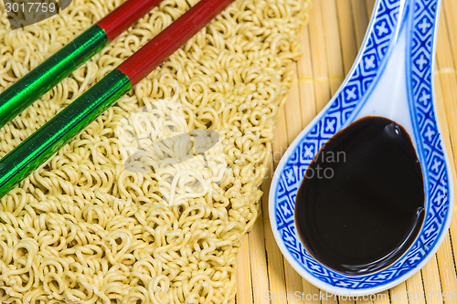 Image of raw chinese noodles with soy sauce