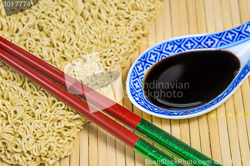 Image of raw chinese noodles with soy sauce