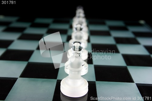 Image of Chess Pieces on a glass board - Pawnage