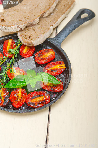 Image of baked cherry tomatoes with basil and thyme