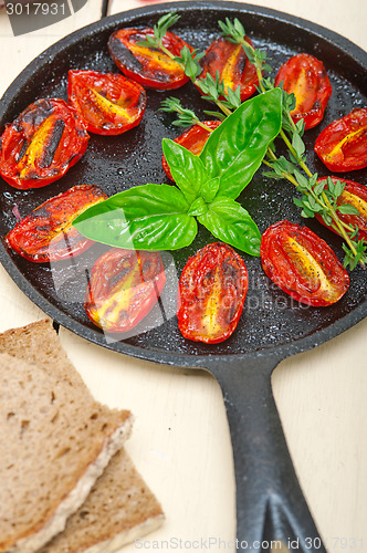 Image of baked cherry tomatoes with basil and thyme