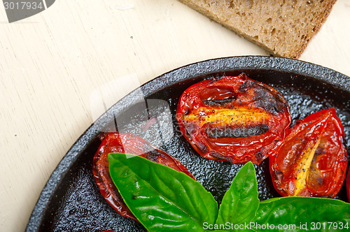 Image of baked cherry tomatoes with basil and thyme