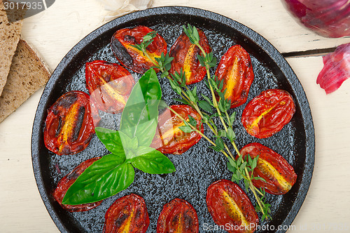 Image of baked cherry tomatoes with basil and thyme