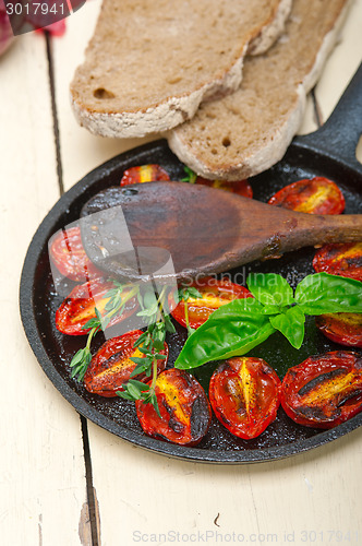 Image of baked cherry tomatoes with basil and thyme