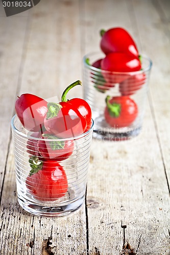 Image of red hot chilli peppers in glasses 