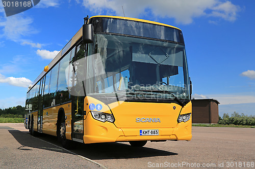 Image of Yellow Scania Citywide Bus at Bus Stop