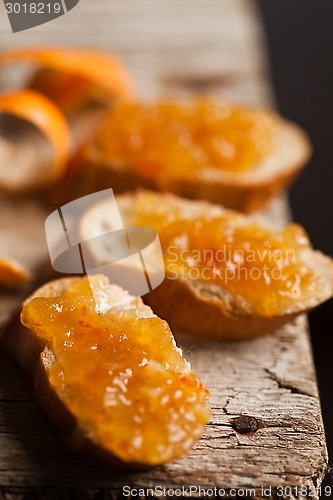 Image of pieces of baguette with orange marmalade