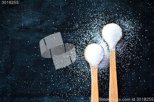 Image of sugar in wooden spoons