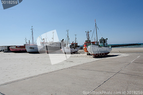 Image of a few fishingboat on land