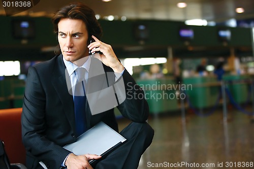 Image of businessman in the airport l