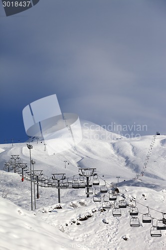 Image of Ski slope and ropeways in evening