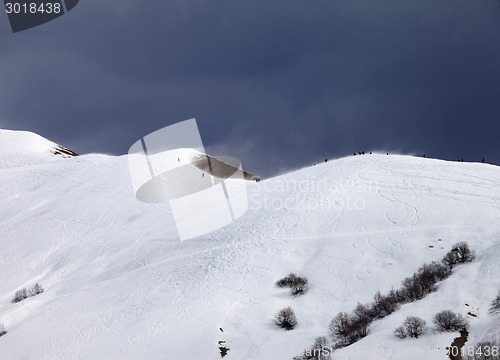 Image of Off piste slope and overcast gray sky in windy day