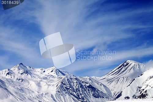 Image of Winter snowy mountains in windy day