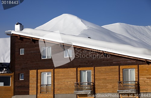 Image of Snowy hotel in winter mountains at nice day